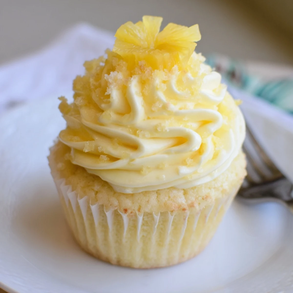 Cooling rack holds Dole Whip Cupcakes Recipe, tropical aroma and golden tops