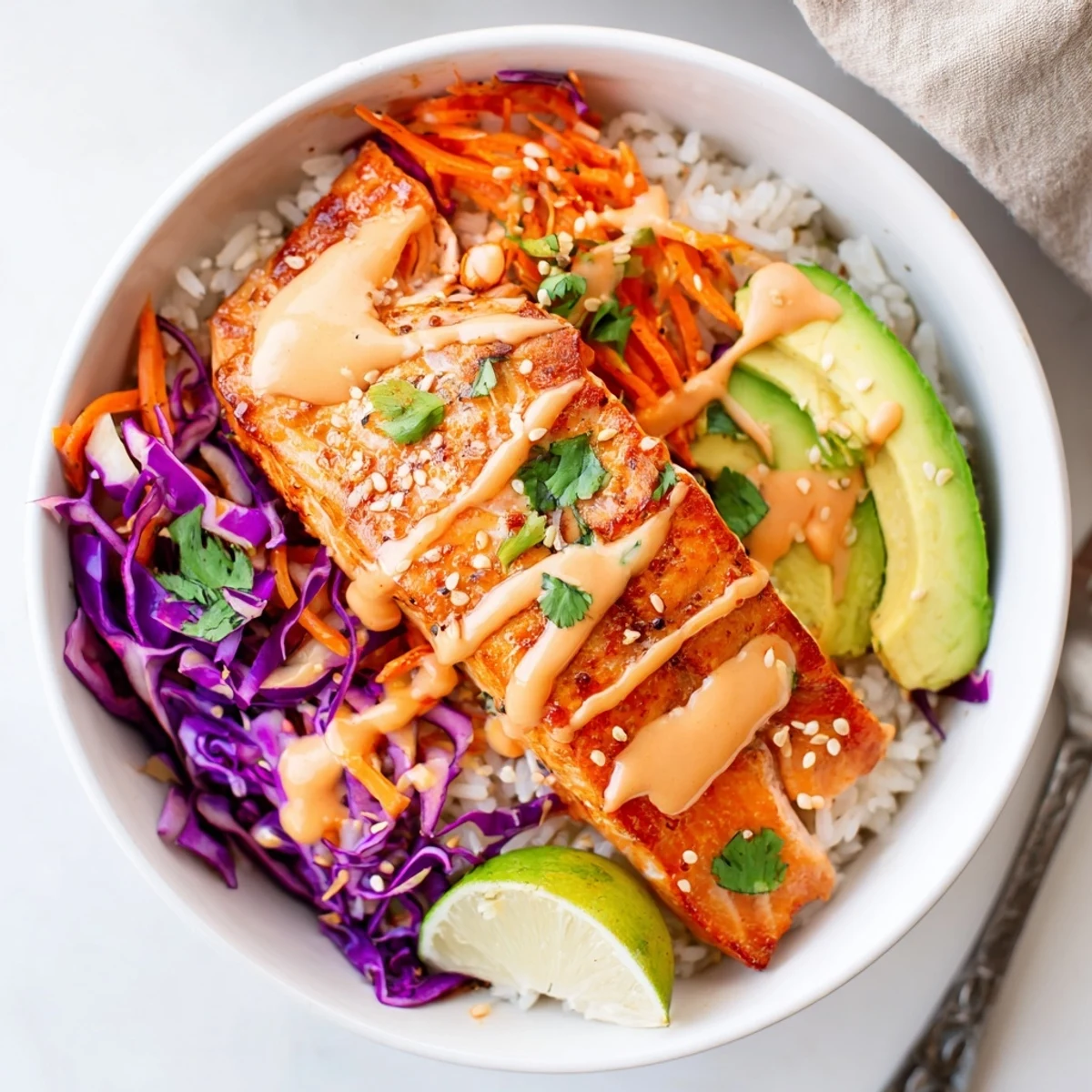Bang Bang Salmon Bowls Recipe showcasing tender roasted salmon, creamy sauce, vibrant veggies.