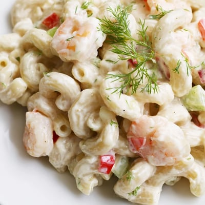 Shrimp macaroni salad loaded with crisp celery, bell pepper, and dill